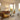 Z-Wave plug-in dimmer and a softly lit lamp in a warm mid-century modern room, with cyan rings showing Long Range coverage