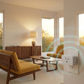 Z-Wave plug-in dimmer and a softly lit lamp in a warm mid-century modern room, with cyan rings showing Long Range coverage